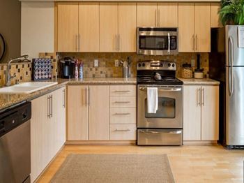 Slab granite countertops with tile backsplash