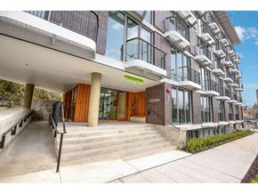 Seattle apartment for rent - Fremont, WA Apartments For Rent - Inspire Fremont - Streetview Of The Building, Large Glass Windows, Wheelchair Ramp, Paved Side Walk, And White Balconies.