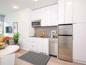 Seattle apartment for rent - Apartments In Seattle, WA - Inspire Fremont - Kitchen With Granite-Style Countertops, Large Cabinets, And Modern Appliances.