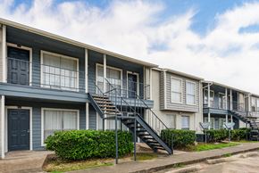 Houston apartment for rent - a row of apartment buildings with stairs and balconies