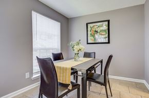 Harvey apartment for rent - Westchase Apartments in Harvey LA photo of a dining room with a table with chairs and a vase of flowers