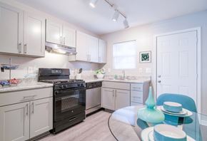 Atlanta apartment for rent - Kitchen with black appliances and stainless steel fixtures at Westwood Glen Atlanta GA