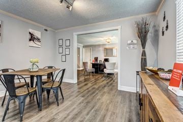 Gretna apartment for rent - the dining room and living room of a home with a table and chairs and a