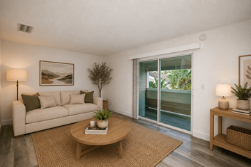 Orlando apartment for rent - A living room with a couch, a table, and a painting on the wall.