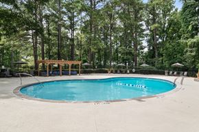 Smyrna apartment for rent - Resort-style swimming pool with lounge seating at Wyndcliff Galleria apartment community in Smyrna GA