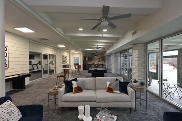 Chattanooga apartment for rent - A living room with a white couch and a ceiling fan.