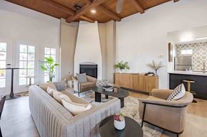 Henderson apartment for rent - A living room with a grey sofa and a black coffee table.