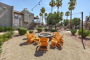 Henderson apartment for rent - A patio with a fire pit and chairs.