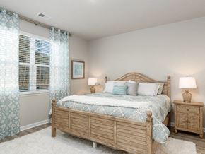 Myrtle Beach triplex for rent - Myrtle Beach, SC Homes-The Palmer at Carolina Forest-Bedroom with Wood Plank Flooring, Faux Wood Blinds, and High Ceilings