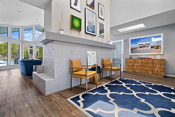 Charleston apartment for rent - A living room with a blue rug and a white fireplace.