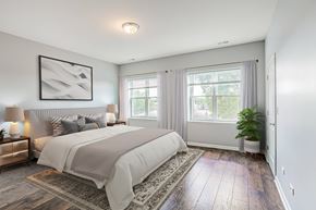 Chicago apartment for rent - a bedroom with a bed and two windows