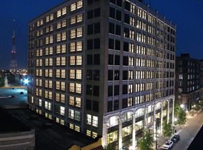 St. Louis apartment for rent - a tall building with many windows at night