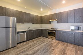 Gresham apartment for rent - a kitchen with wooden cabinets and stainless steel appliances