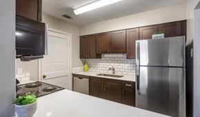 Peachtree City apartment for rent - full kitchen with stainless steel appliances at the preserve at polk apartments
