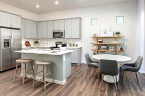 Prescott apartment for rent - an open kitchen and dining area with a table and chairs