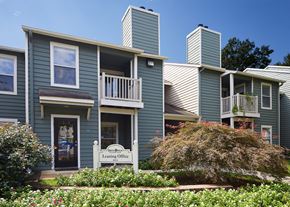 Columbia apartment for rent - an apartment building with blue siding and a white sign