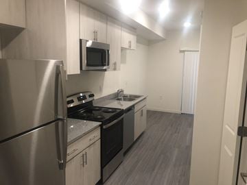 Phoenix apartment for rent - a kitchen with stainless steel appliances and a refrigerator