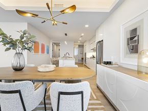 Frisco apartment for rent - A modern dining room with a wooden table and chairs.