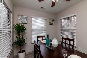 Columbia apartment for rent - a dining room with a table and chairs and windows