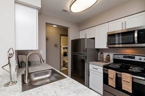 Columbia apartment for rent - a kitchen with stainless steel appliances and granite counter tops