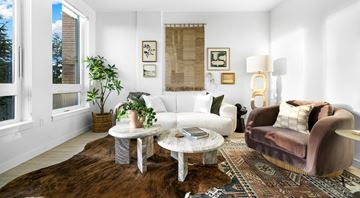 Seattle apartment for rent - A living room with a brown rug and a brown chair.
