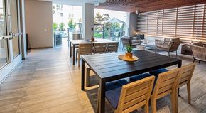 Los Angeles apartment for rent - A dining room with a long table and chairs.