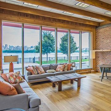 Edgewater apartment for rent - A living room with a grey couch and a wooden coffee table.