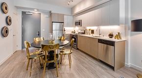 Los Angeles apartment for rent - A modern kitchen with a dining table set for six.