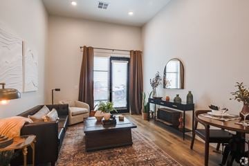 Greeley apartment for rent - A living room with a brown coffee table and a white sofa.