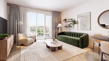 Aurora apartment for rent - A living room with a green sofa and a coffee table.