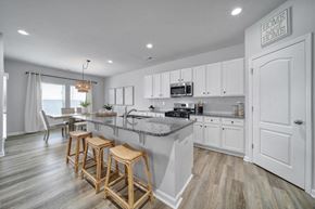 Indian Trail townhouse for rent - Spacious kitchen with island, stainless steel appliances, and granite countertops in Indian Trail, NC townhome