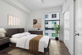 Miami apartment for rent - Spacious bedroom at MB Station apartments featuring large windows, modern finishes, and natural light near Brickell, Coral Gables, and Downtown Miami.