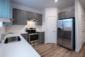 Vancouver apartment for rent - kitchen with a refrigerator, stove, and sink
