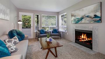 Silverdale apartment for rent - a living room with a fireplace and a couch