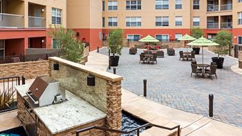 Open air courtyard with viking bbq grill and fire pit lounge area