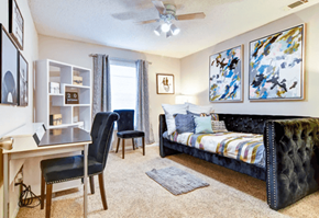 Smyrna apartment for rent - Spacious bedroom with a large window allowing abundant natural light, neutral walls, and plush carpeting at Wyndcliff Galleria.