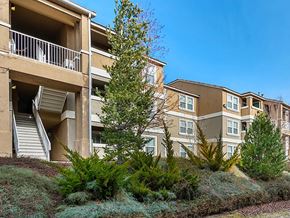 Reno apartment for rent - an apartment building with stairs and trees in front of it