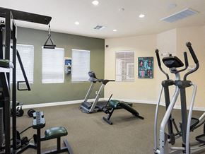Reno apartment for rent - a gym with exercise equipment in a home gym