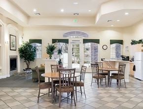 Reno apartment for rent - a dining room with tables and chairs and a fireplace