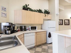 Reno apartment for rent - a kitchen with a sink and a refrigerator