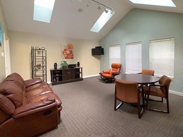 Everett apartment for rent - a living room with a leather couch and a table