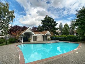 Everett apartment for rent - a large swimming pool in front of a house