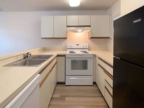 Everett apartment for rent - a kitchen with a stove and a sink and a refrigerator