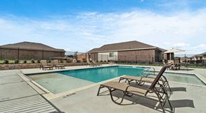 Lewisville apartment for rent - Homes in Lewisville, TX for Rent - The Villas at Rockbrook - Swimming Pool with Spacious Sundeck, Lounge Seats, Umbrella Tables, and Chairs.