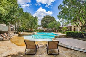 San Antonio apartment for rent - Mission oaks pool surrounded by trees and beach chairs