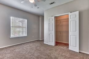 San Antonio apartment for rent - Bed room with white doors and closet and carpet floor