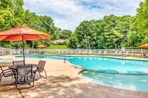 Raleigh apartment for rent - Swimming pool with lounge seating at Grand Arbor Reserve Apartments in Raleigh, NC 27607, near Central Raleigh.