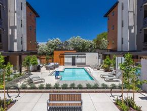 Santa Clara apartment for rent - Apartments in Santa Clara, CA, for Rent - Santana Terrace Apartments - Resort-Style Swimming Pool With Sundeck, Lounge Seating, Landscaped Plantings, and Pergola.