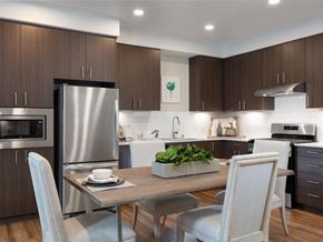 Santa Clara apartment for rent - 2-Bedroom Apartments in Santa Clara, CA - Santana Terrace - Kitchen with Stainless Steel Appliances, Dark Brown Cabinetry, and Modern Hardware