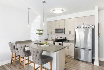 Charleston apartment for rent - a kitchen with a island and a stainless steel refrigerator